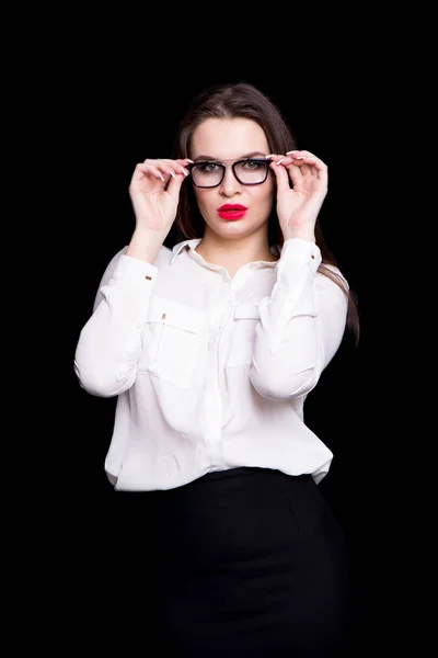 Portrait of a sexy business woman in the studio on a black background — Stock Photo, Image