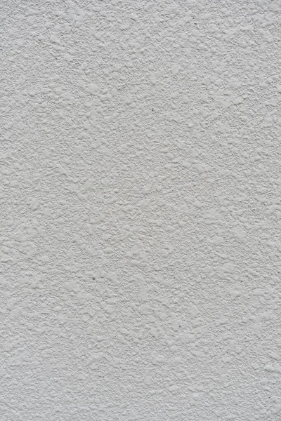 Background from texture closeup of decorative plaster on a white wall surface — Stock Photo, Image