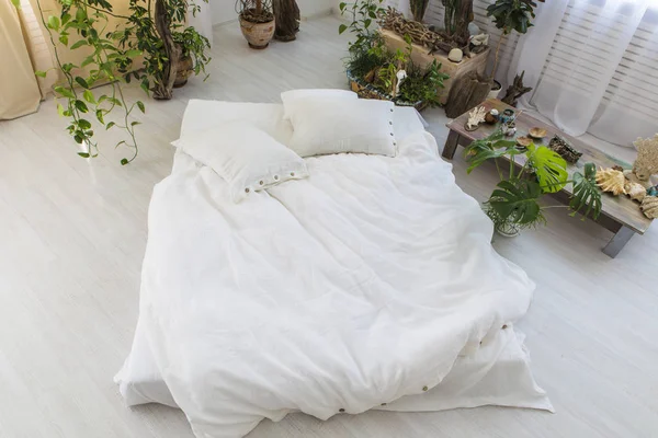 Natural eco-friendly linen bed in the interior — 스톡 사진