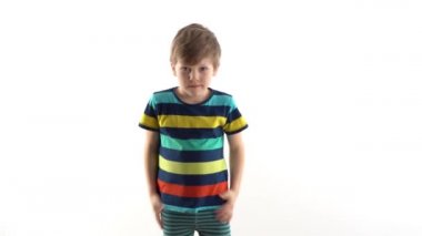 little boy in the studio on a white background dancing funny dance
