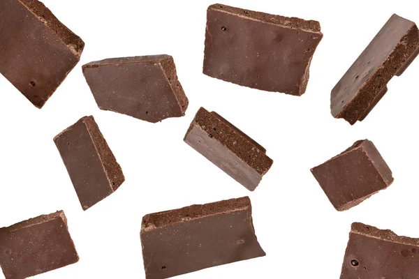 Trozos de chocolate cayendo, aislados en blanco — Foto de Stock