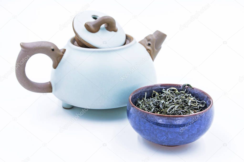 Chinese Green tea. (Huang Shan Mao Feng) in a blue ceramic bowl