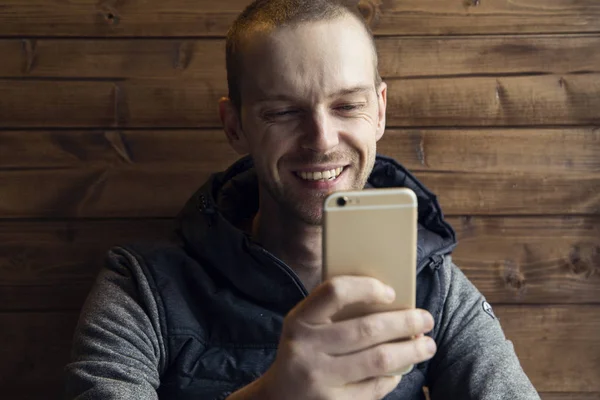 Happy man using his mobile smartphone