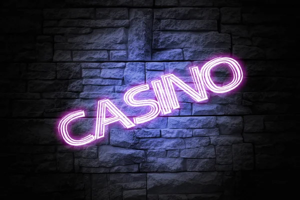 Glowing word \'CASINO\' on brick wall