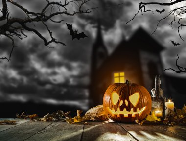Scary halloween pumpkin with horror background clipart