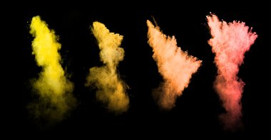 Explosion of colored powders on black background clipart