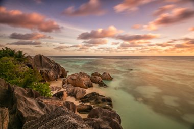 Beautiful Seychelles beach at La Digue in sunset clipart