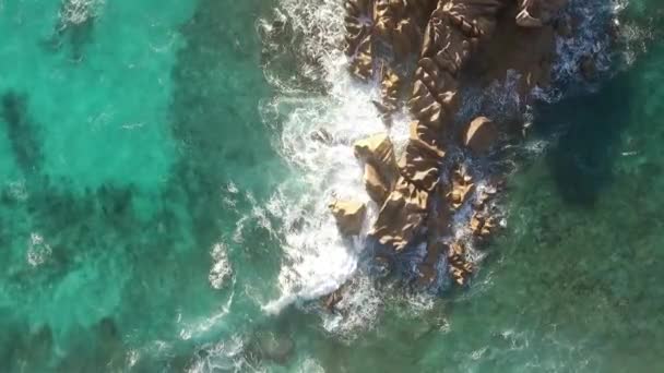 Aerial view of rocks in sea — Stock video