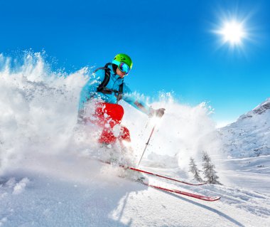Freeride skier on piste running downhill clipart