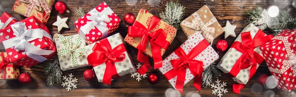 Christmas gift boxes placed on wooden planks — Stock Photo, Image