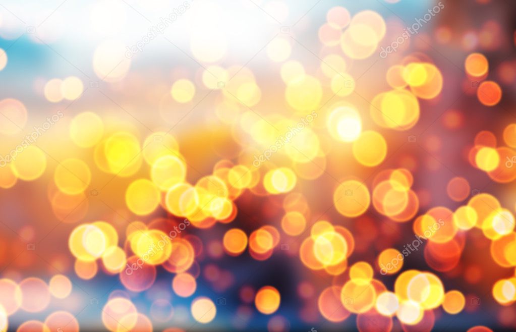 Blurred abstract golden spot lights on dark background