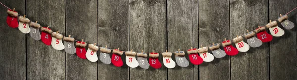 Advent calendar on wooden background — Stock Photo, Image