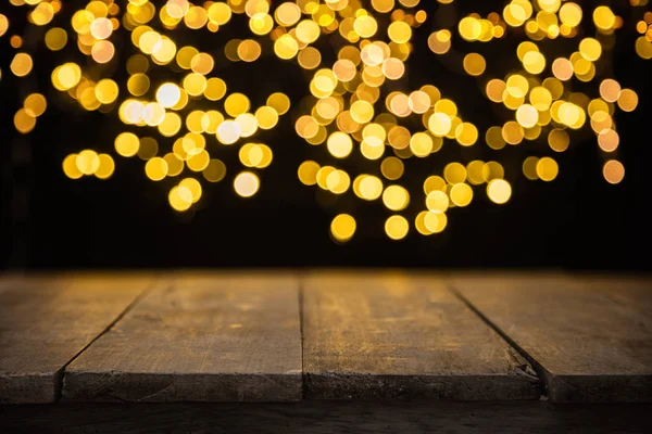 Blurred abstract golden spot lights with wood — Stock Photo, Image