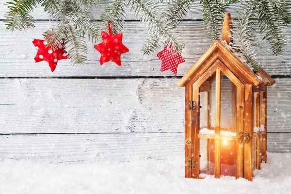 Burning lantern and christmas decoration on wood — Stock Photo, Image