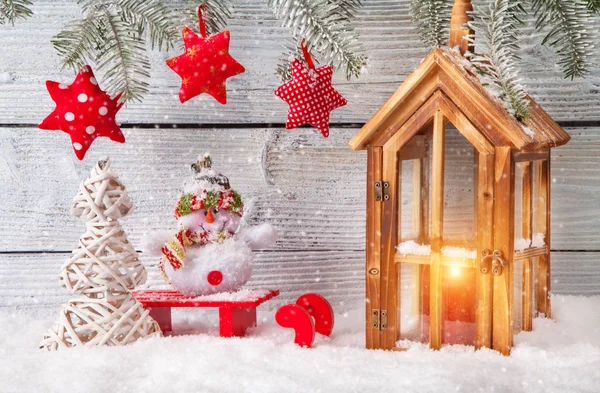 Burning lantern and christmas decoration on wood — Stock Photo, Image