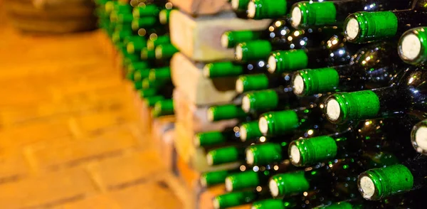 Many bottles in wine cellar — Stock Photo, Image