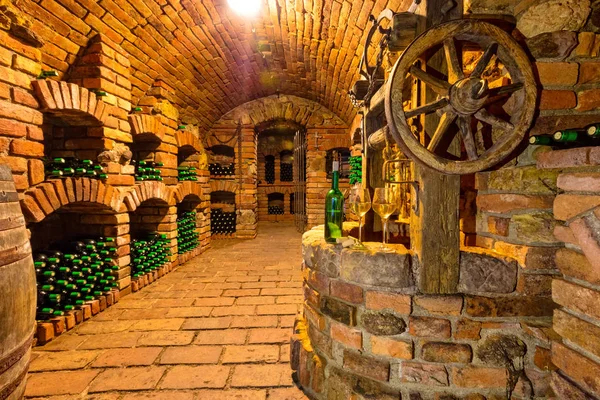 Small wine cellar with bottle and glasses of wine — Stock Photo, Image