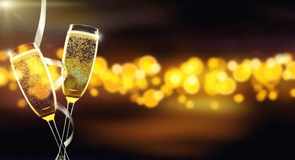 Two glasses of champagne over blur spots background — Stock Photo, Image