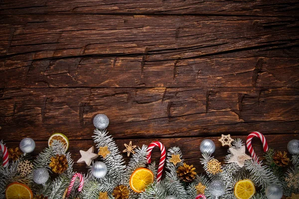 Christmas garland decoration placed on wooden planks — Stock Photo, Image