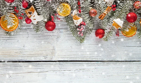 Christmas garland decoration placed on wooden planks — Stock Photo, Image