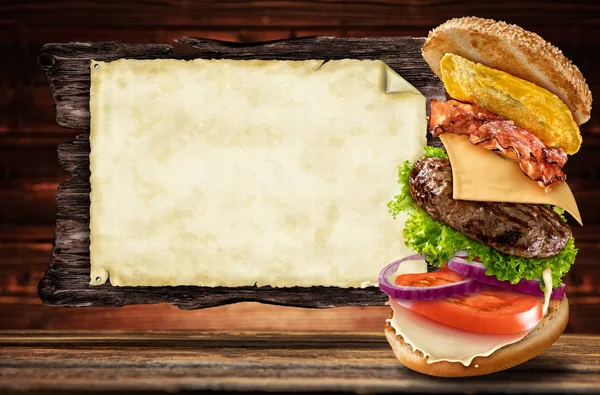 Maxi hamburger with flying ingredients — Stock Photo, Image
