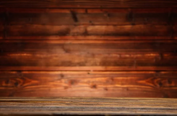 Vintage wood table in wood wall interior — Stock Photo, Image