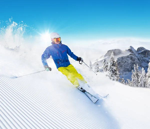 Skier on piste running downhill — Stock Photo, Image