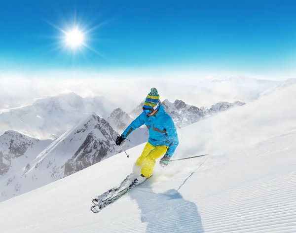 Skier on piste running downhill — Stock Photo, Image