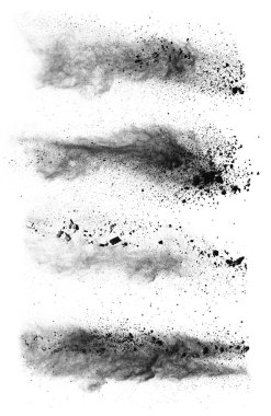 Freeze motion of black dust explosions on white background clipart