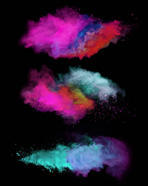 Explosion of colored powders on black background — Stock Photo, Image