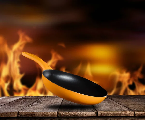 Empty pan with flames on background — Stock Photo, Image