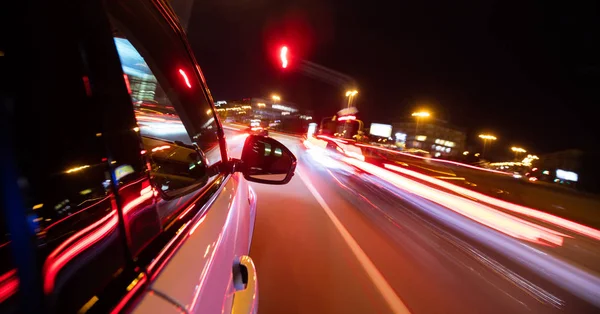 Car driving in city at night, blur motion — Stock Photo, Image