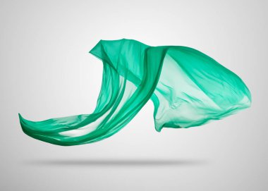 Gri arka plan üzerine yumuşak zarif yeşil kumaş