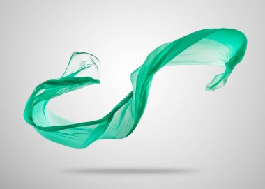 Gri arka plan üzerine yumuşak zarif yeşil kumaş