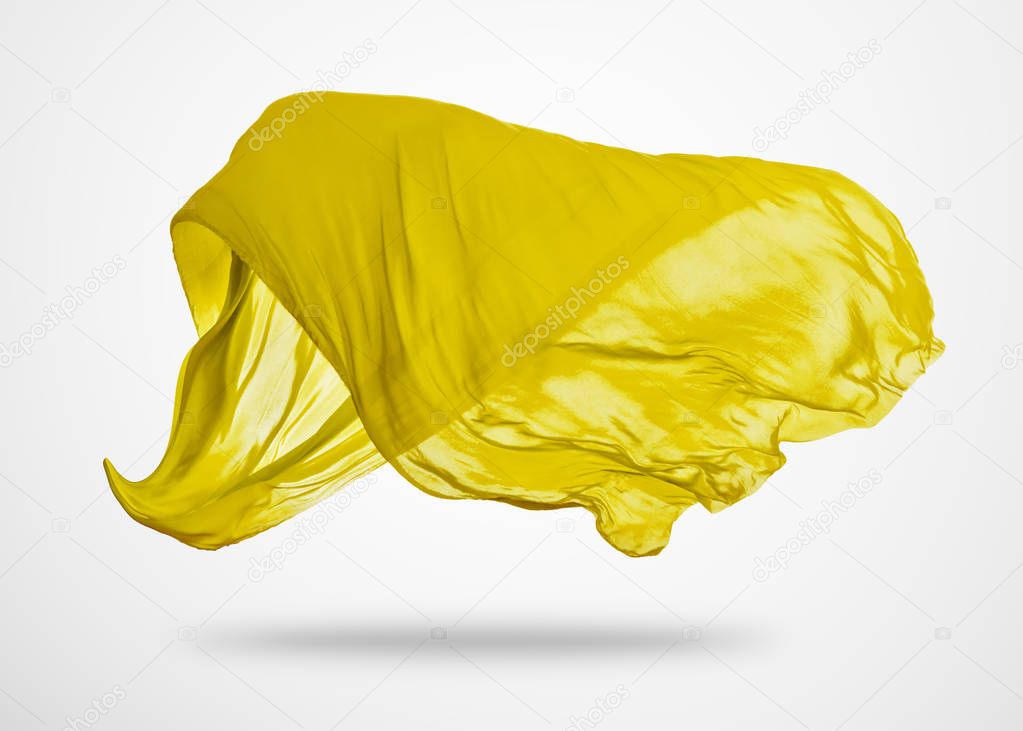 Smooth elegant yellow cloth on gray background