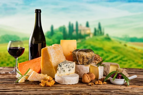 Various kind of cheese served on wood — Stock Photo, Image