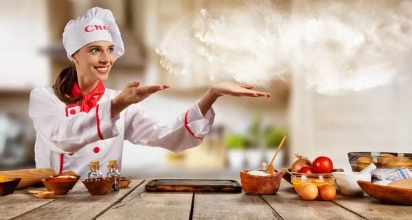 Young chef woman cooker pointing — Stock Photo, Image