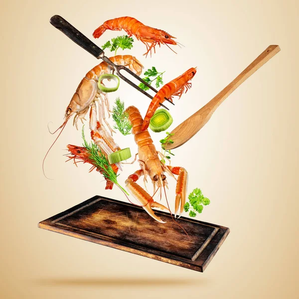 Fresh sea food, prawns and lobsters flying above wooden board — Stock Photo, Image