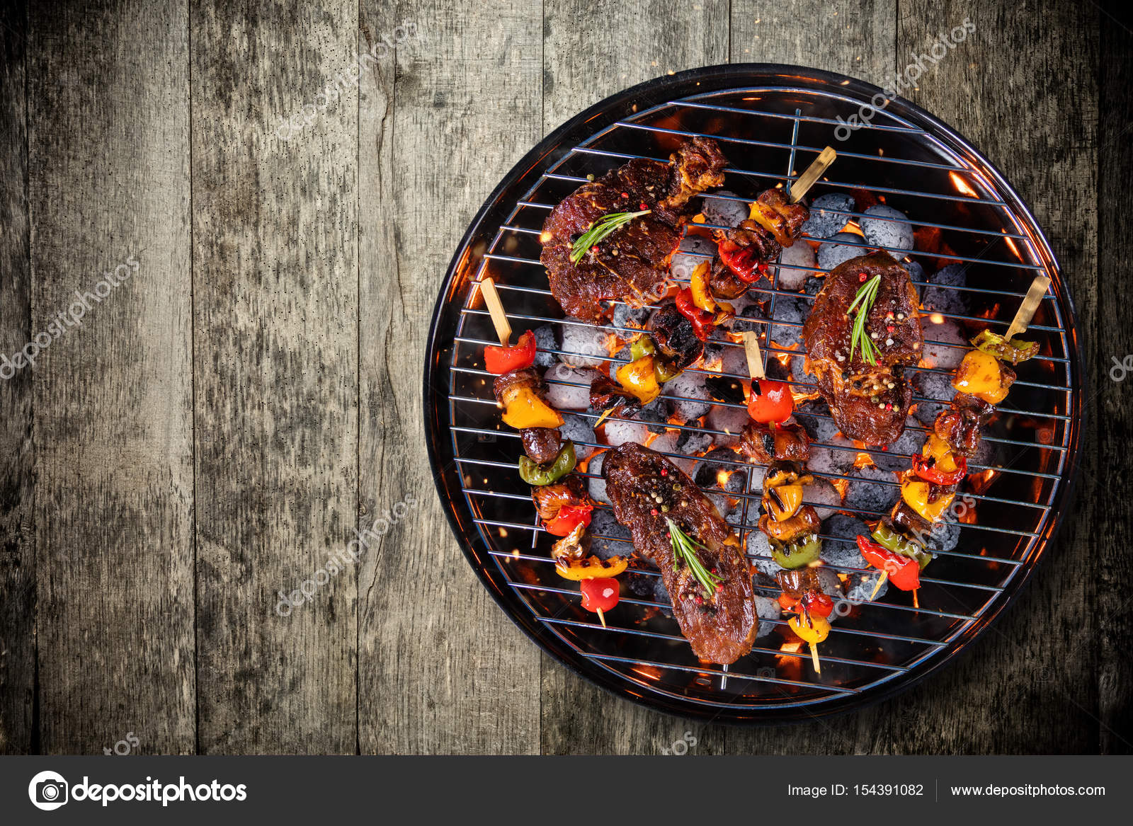 Top view of fresh meat and vegetable grill placed on wooden Stock Photo by ©jag_cz 154391082
