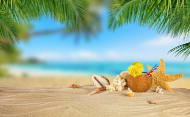 Tropical beach with coconut drink on sand, summer holiday backgr clipart