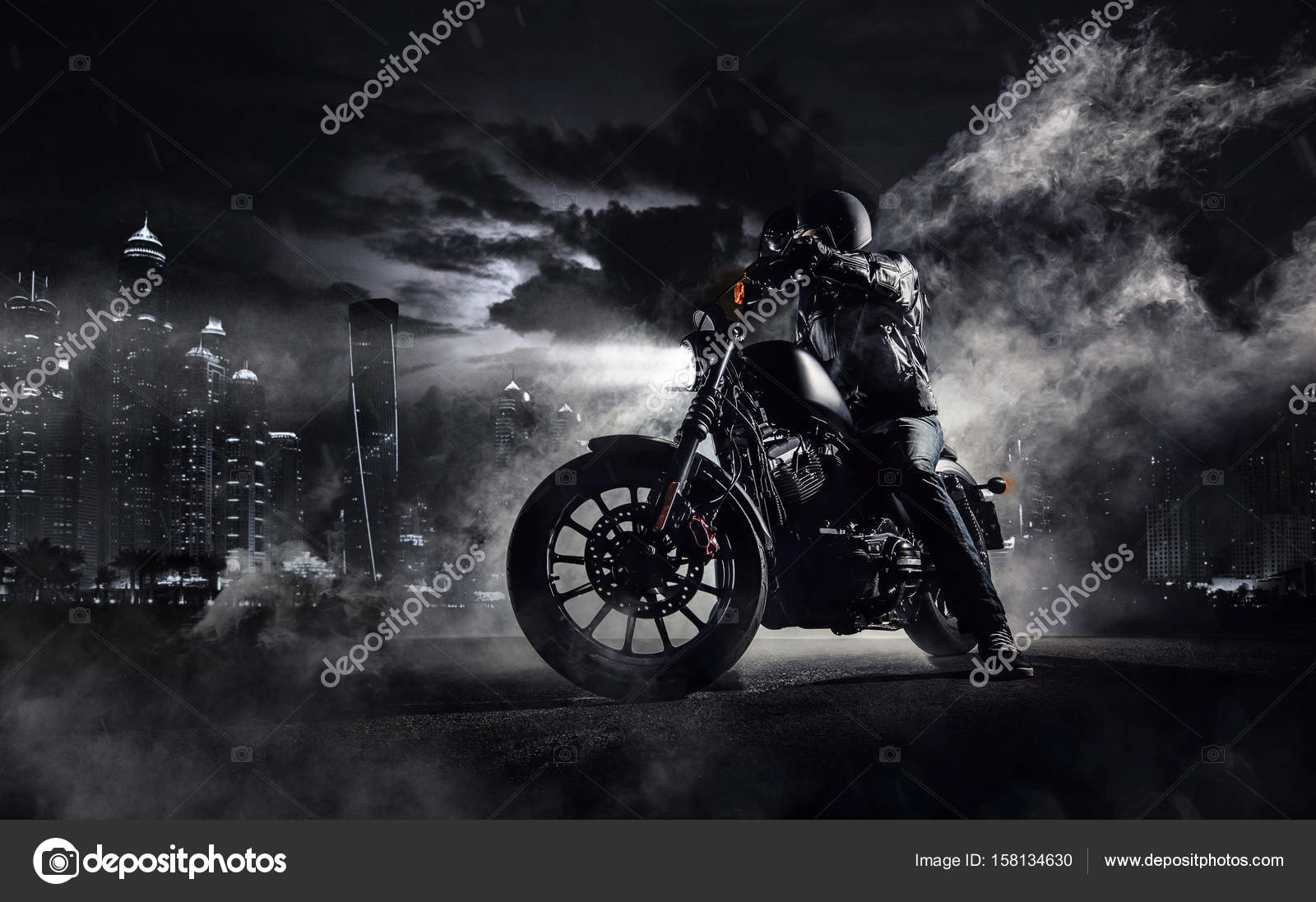 High power motorcycle chopper with man rider at night Stock Photo by ©jag_cz 158134630