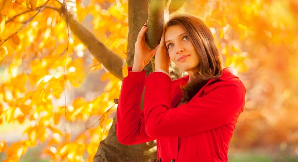 Beautiful young woman autumn portrait with red jacket — Stock Photo, Image