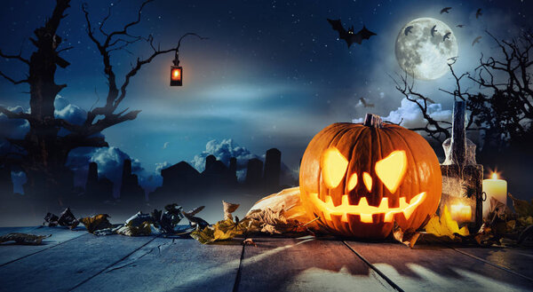 Spooky halloween pumpkin on wooden planks