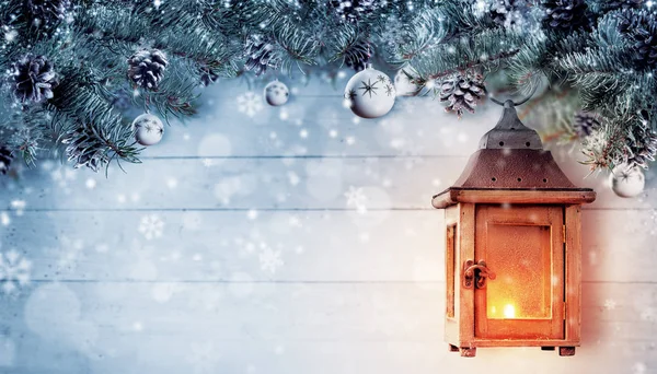 Christmas background with spruce branches and wooden lantern. — Stock Photo, Image