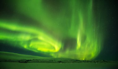 Beautiful aurora borealis in Iceland, shot in early winter perio clipart