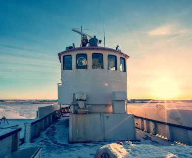 Old fisherman boat in Iceland in grunge colored design clipart