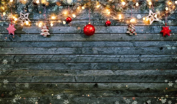 Christmas background with wooden decorations and spot lights. — Stock Photo, Image