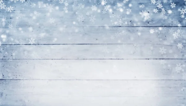 Astratto sfondo invernale con tavole di legno e fiocchi di neve — Foto Stock