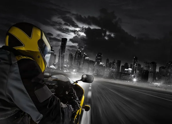 Detail of super-sport motorbike rider heading to the modern city — Stock Photo, Image