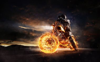 Dark motorbiker staying on burning motorcycle in sunset light clipart